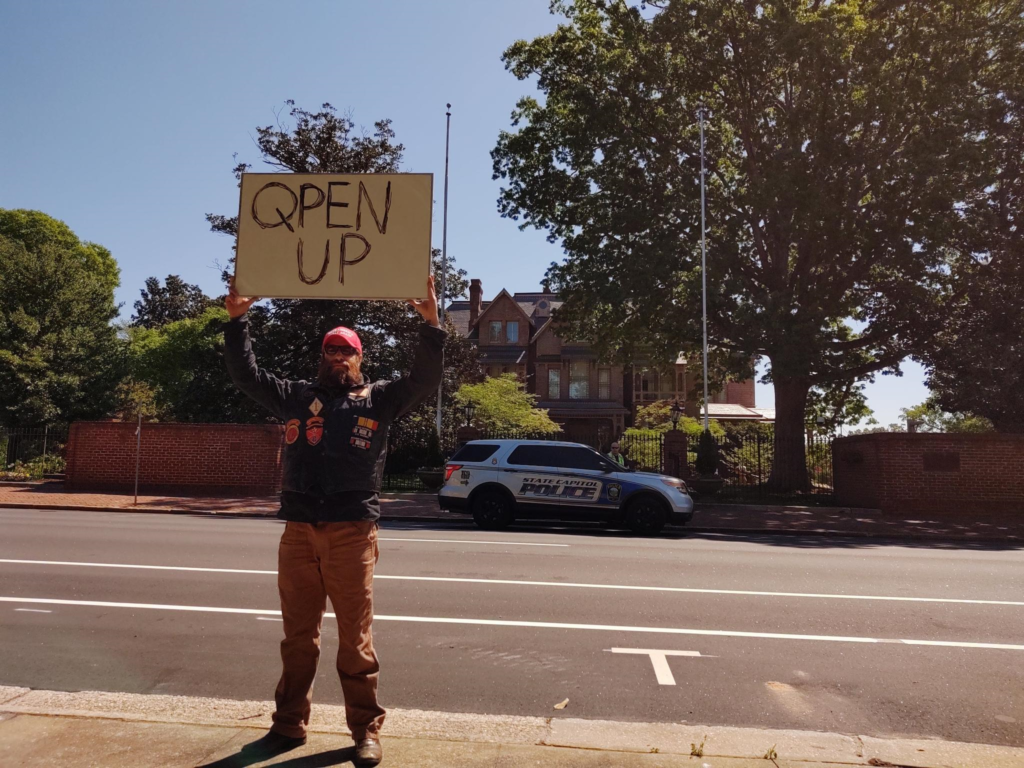 Michael J. Penney at the reopen NC protest in downtown Raleigh, NC across from the Governor's Mansion