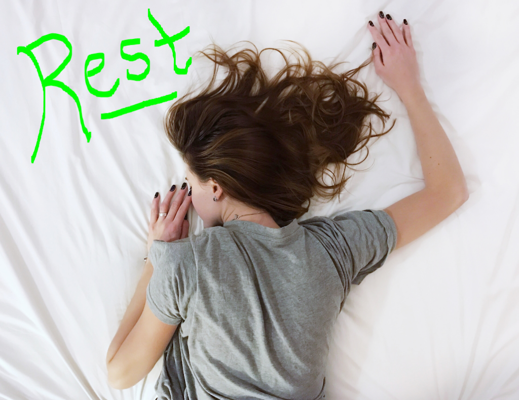 Rest when you can. An image of a woman laying in a bed resting - Michael J. Penney Show