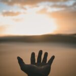 spiritual awakening hand reaching out - Michael J. Penney Show