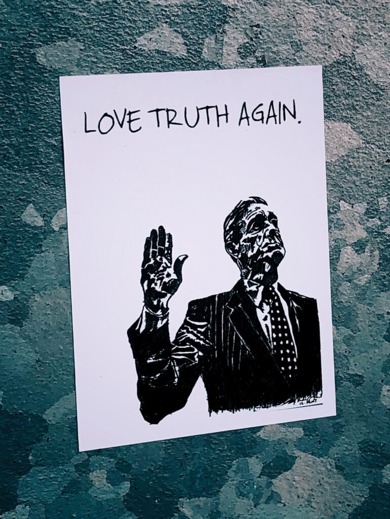 sign on wall... love truth again - Michael J. Penney