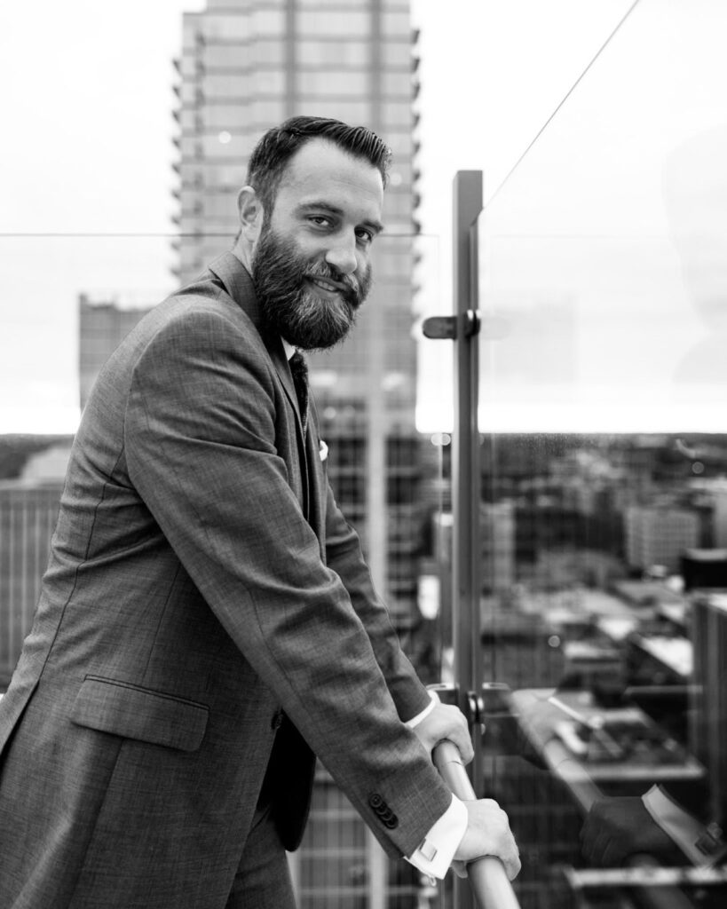 Michael J. Penney standing over the city in black and white photo , Michael J. Penney, MJPenney